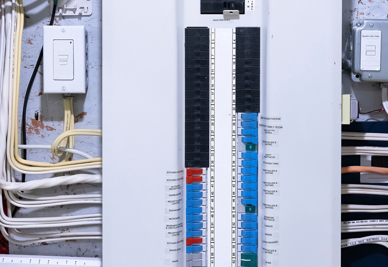 Electrical breaker panel with labeled switches.